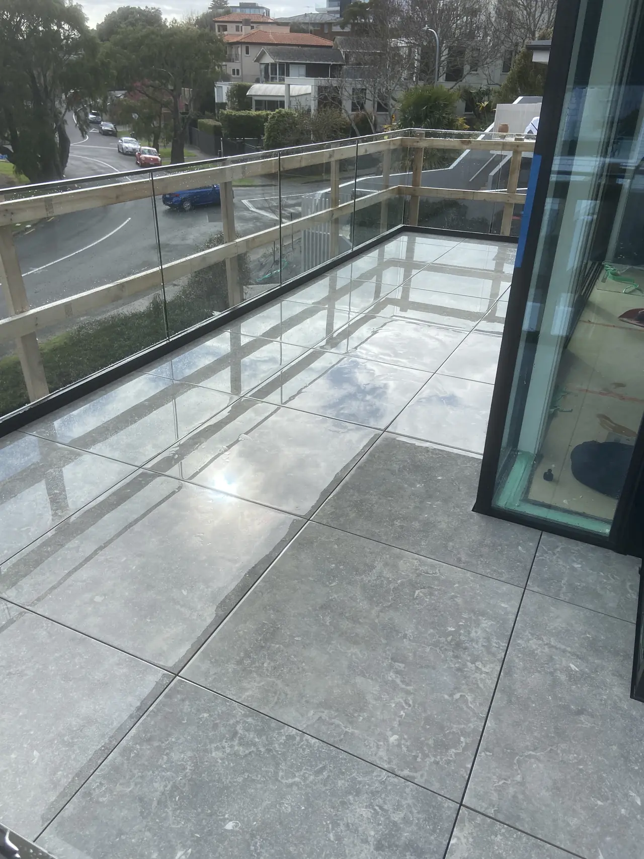 Balcony tiled with large porcelain pavers