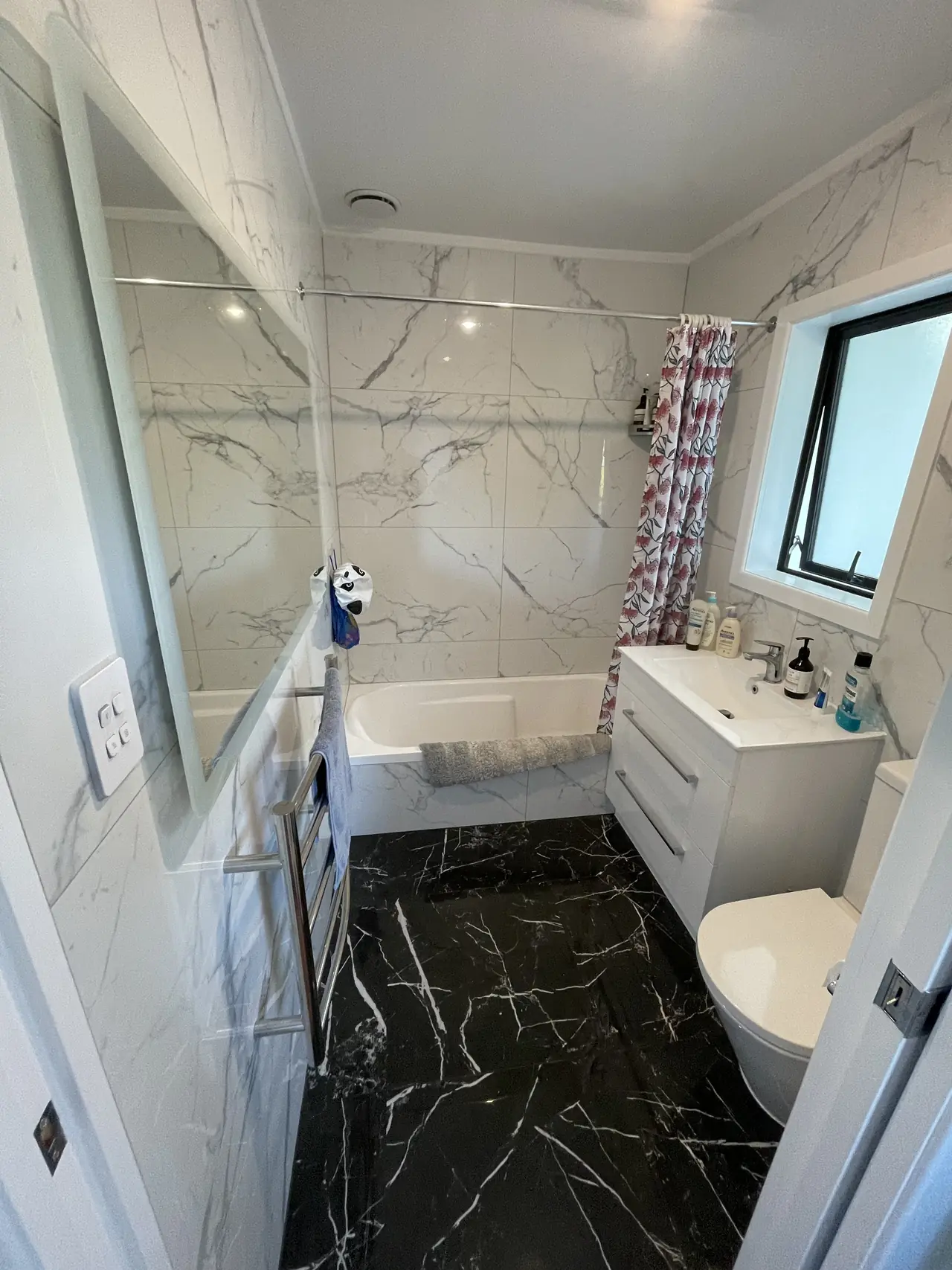 Black marble floor with white marble-look walls