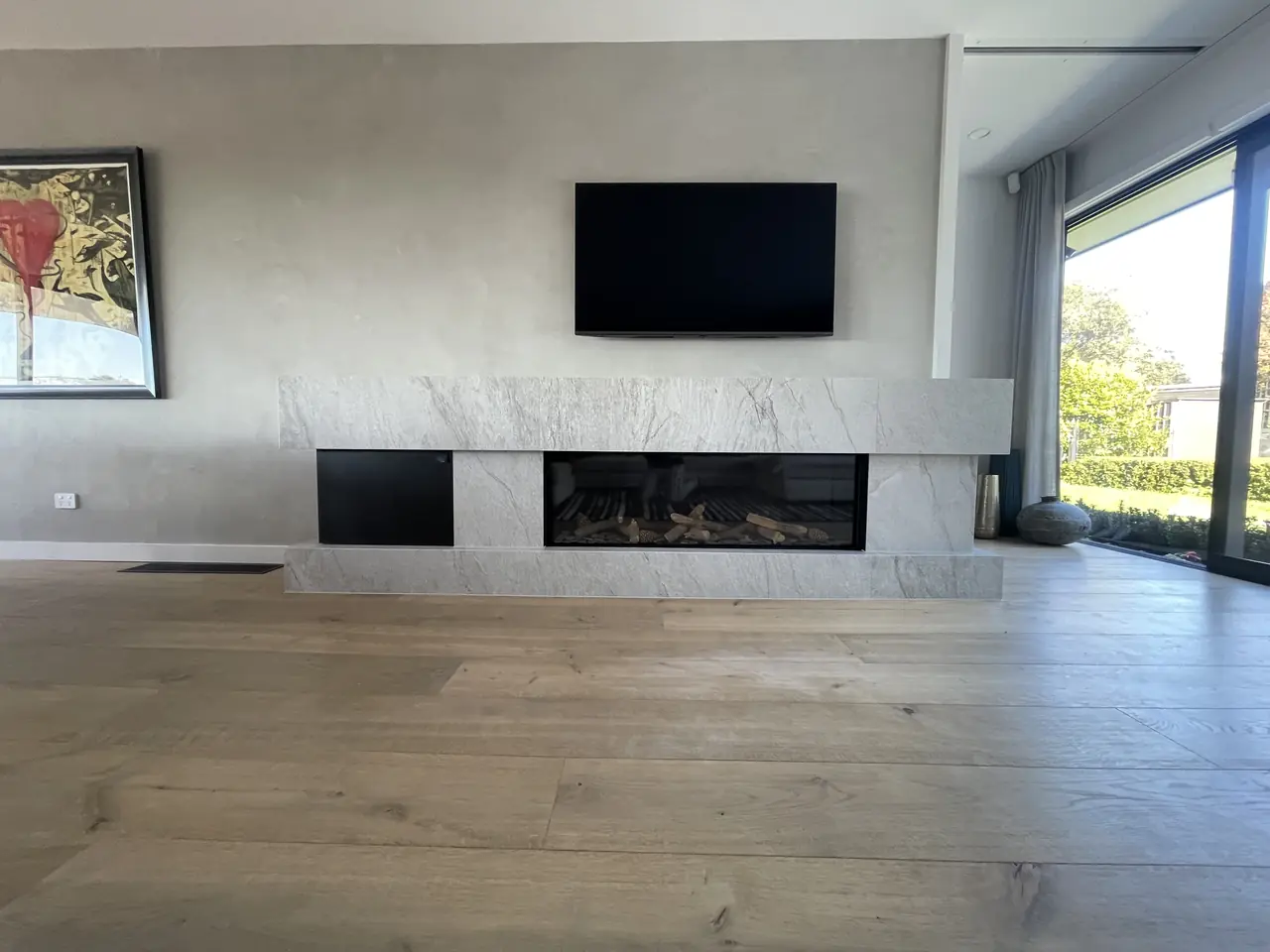 Marble-look large format slab fireplace surround