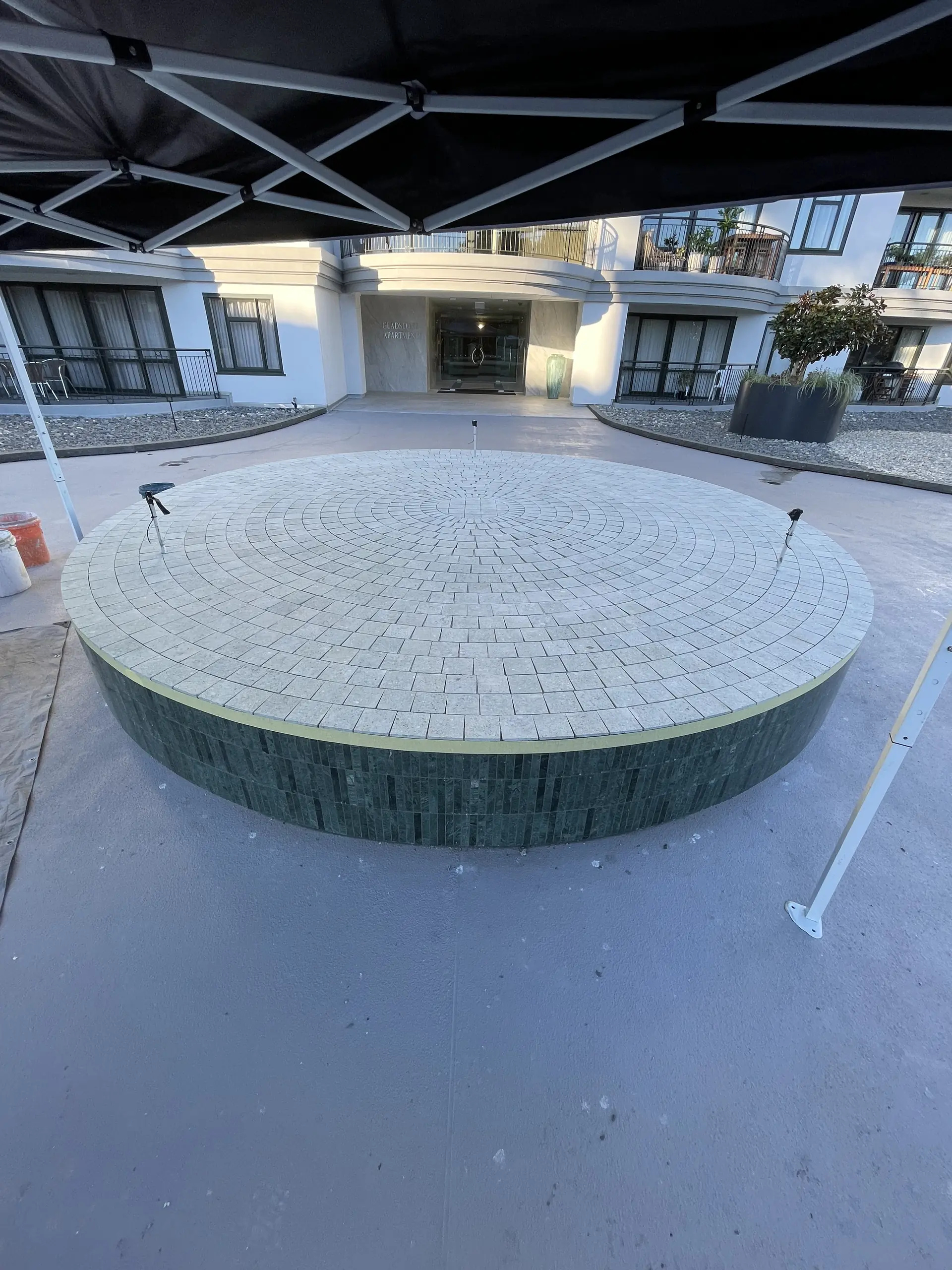 Completed green mosaic fountain plinth