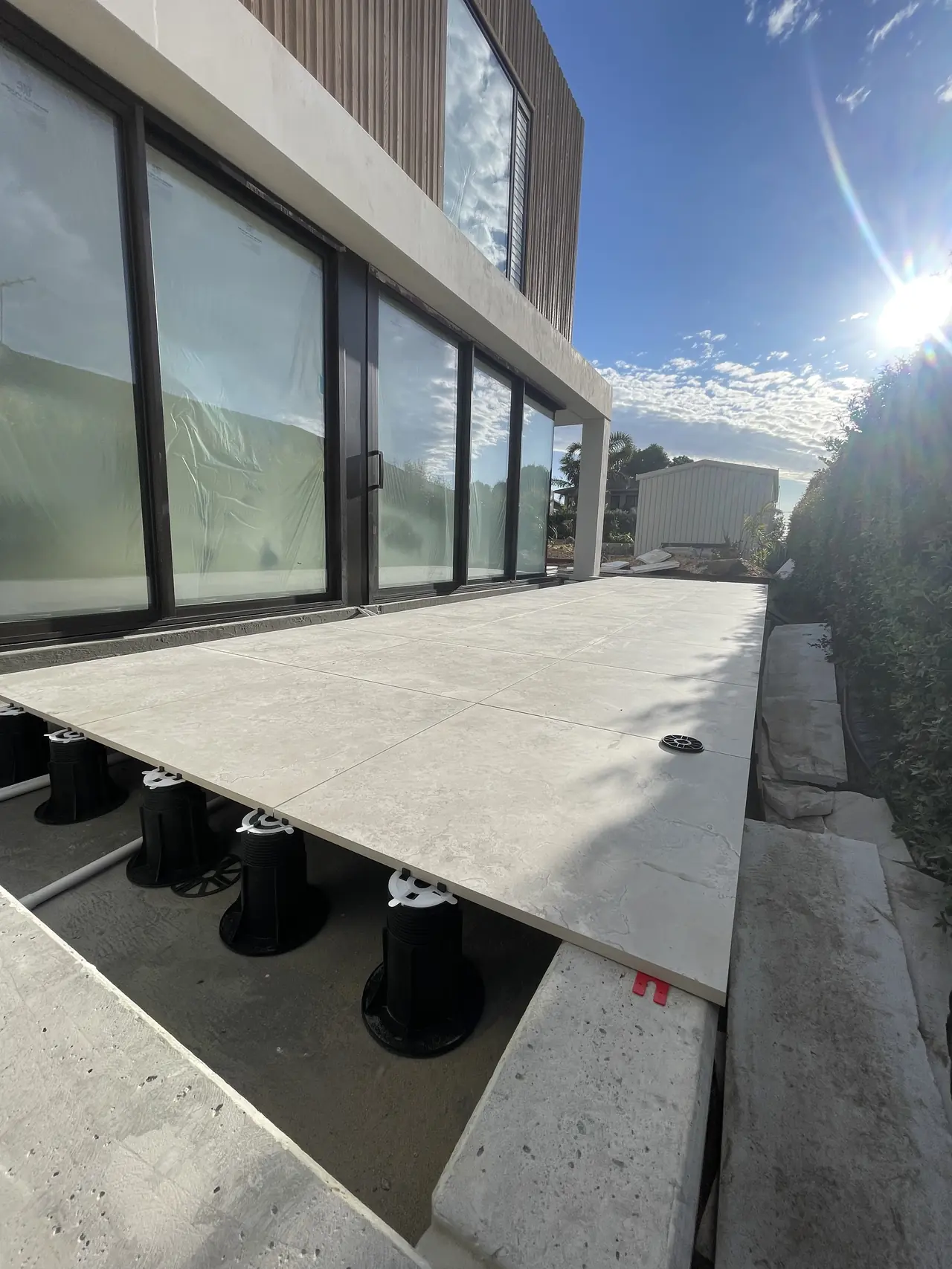 Porcelain deck on adjustable pedestals