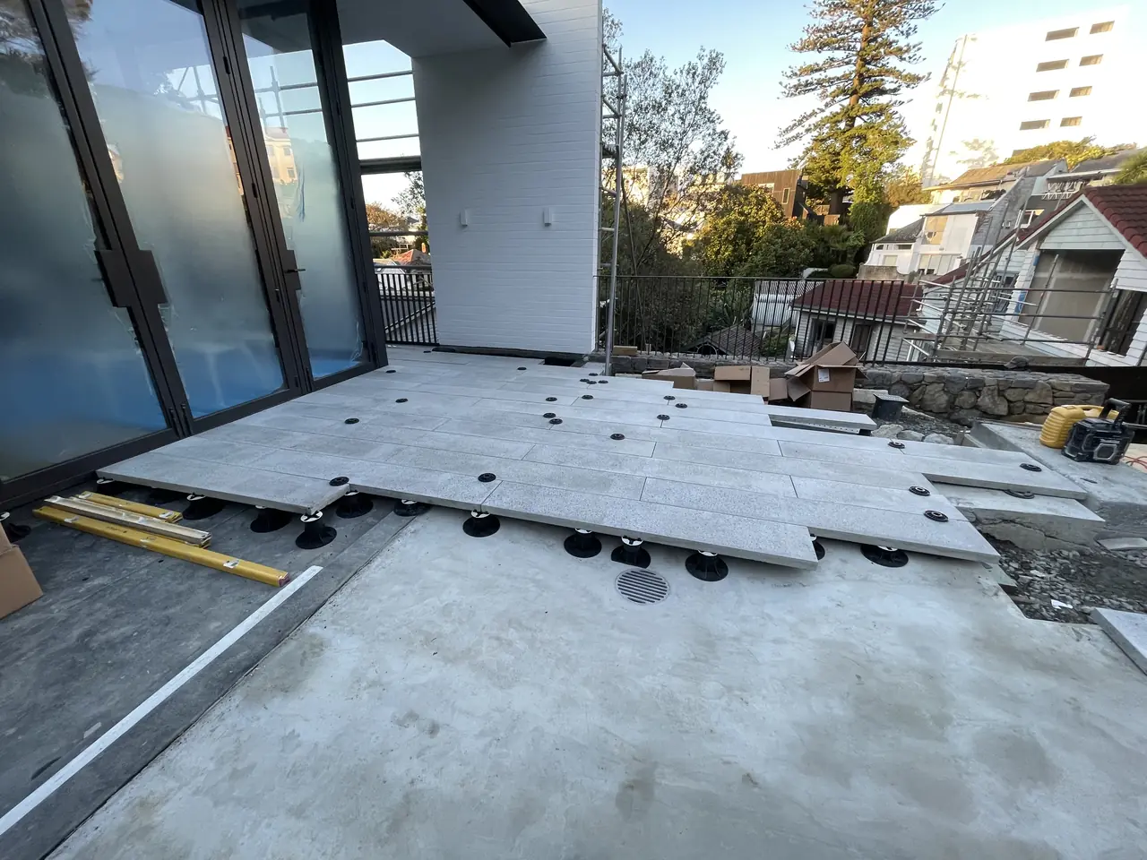 Raised paver deck on pedestals in progress