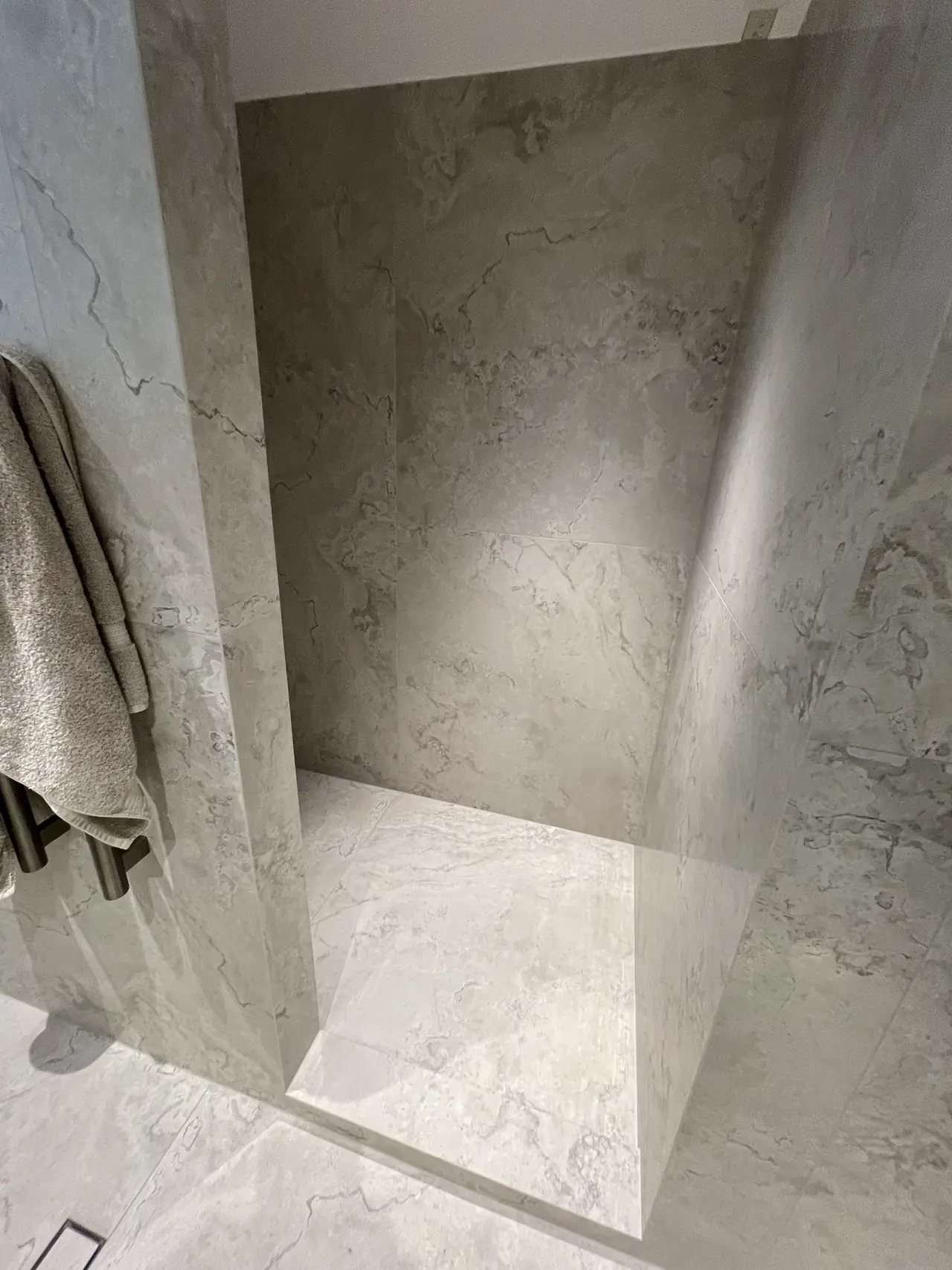 Slab-sized porcelain shower walls