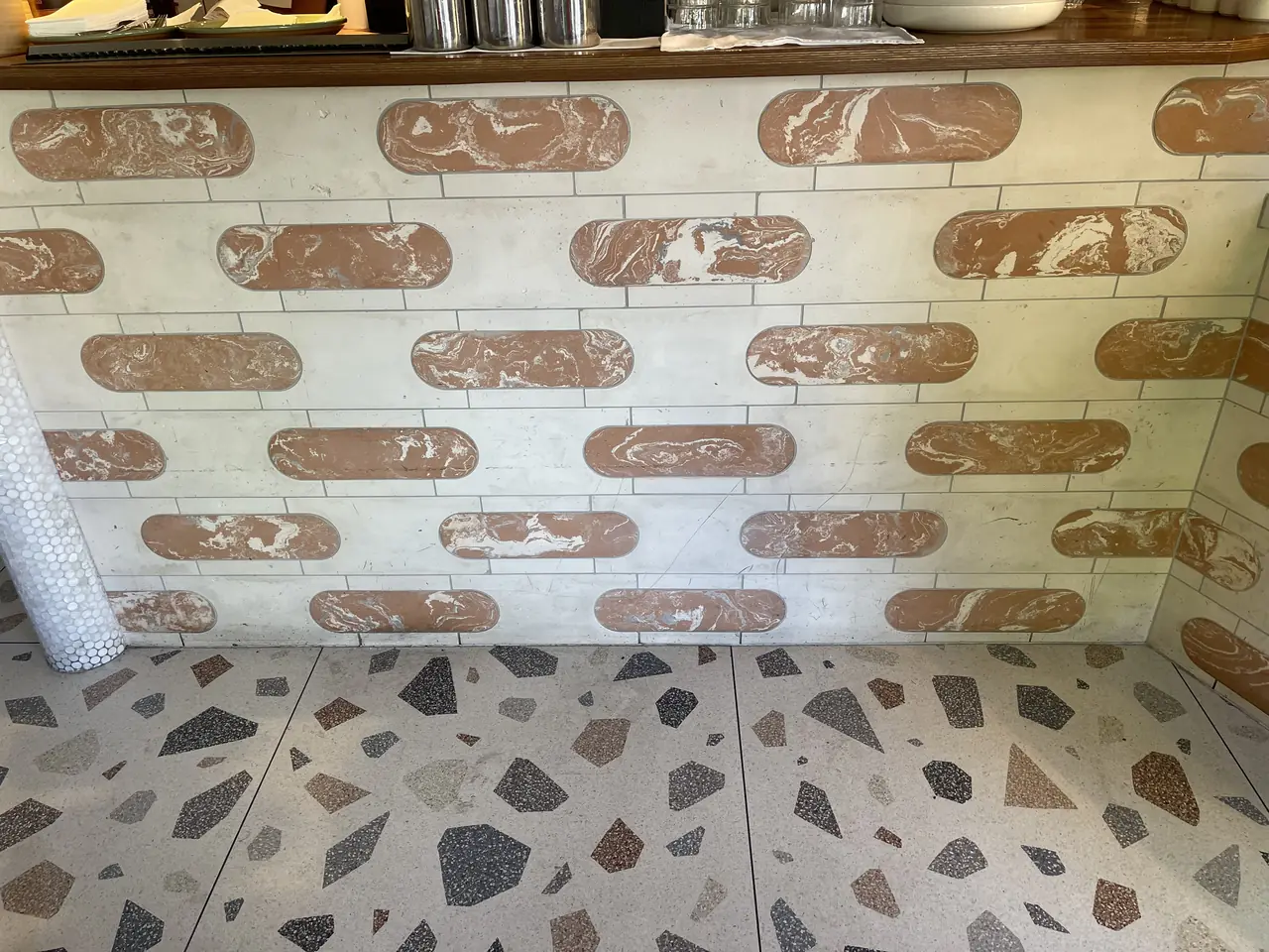 Terrazzo floor and patterned counter in a cafe