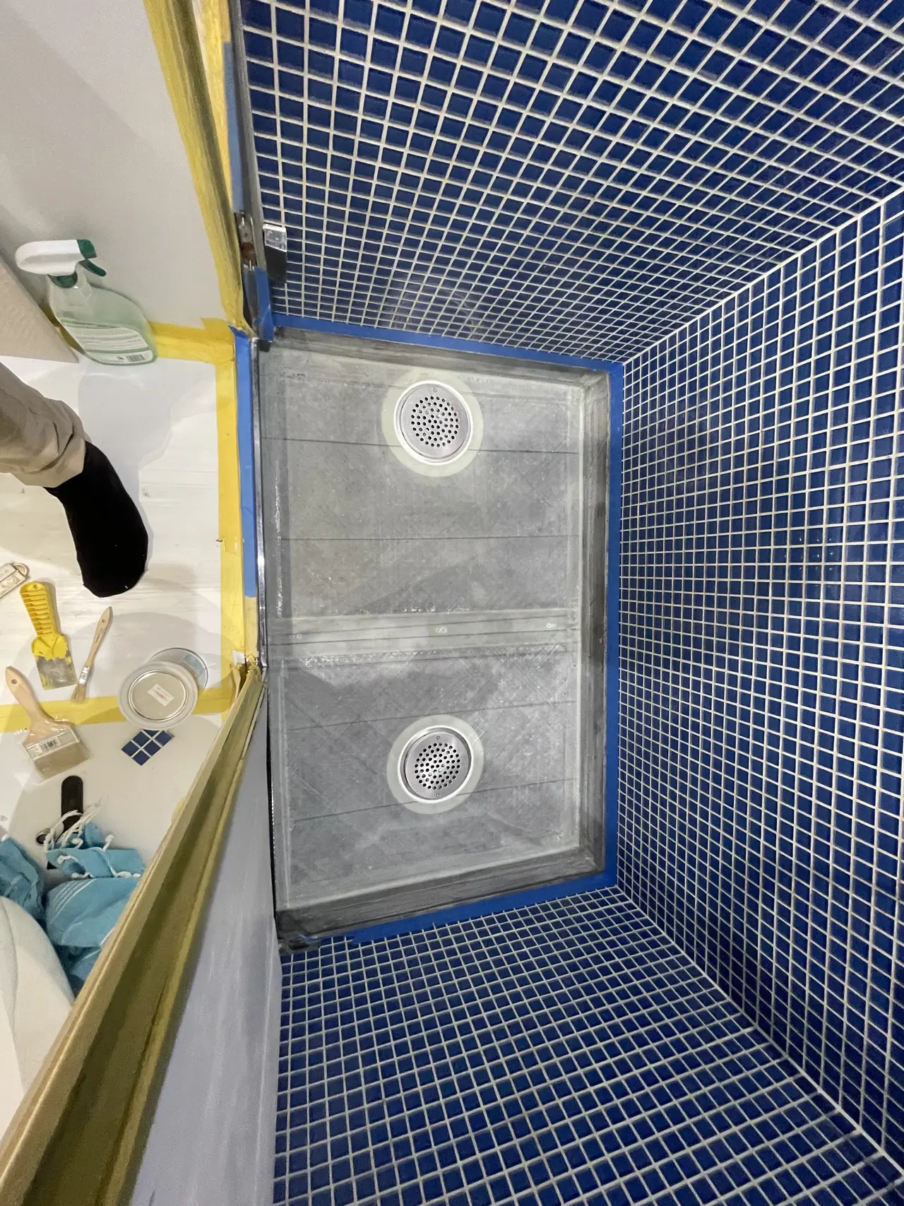 Mosaic-tiled pool with sealed floor