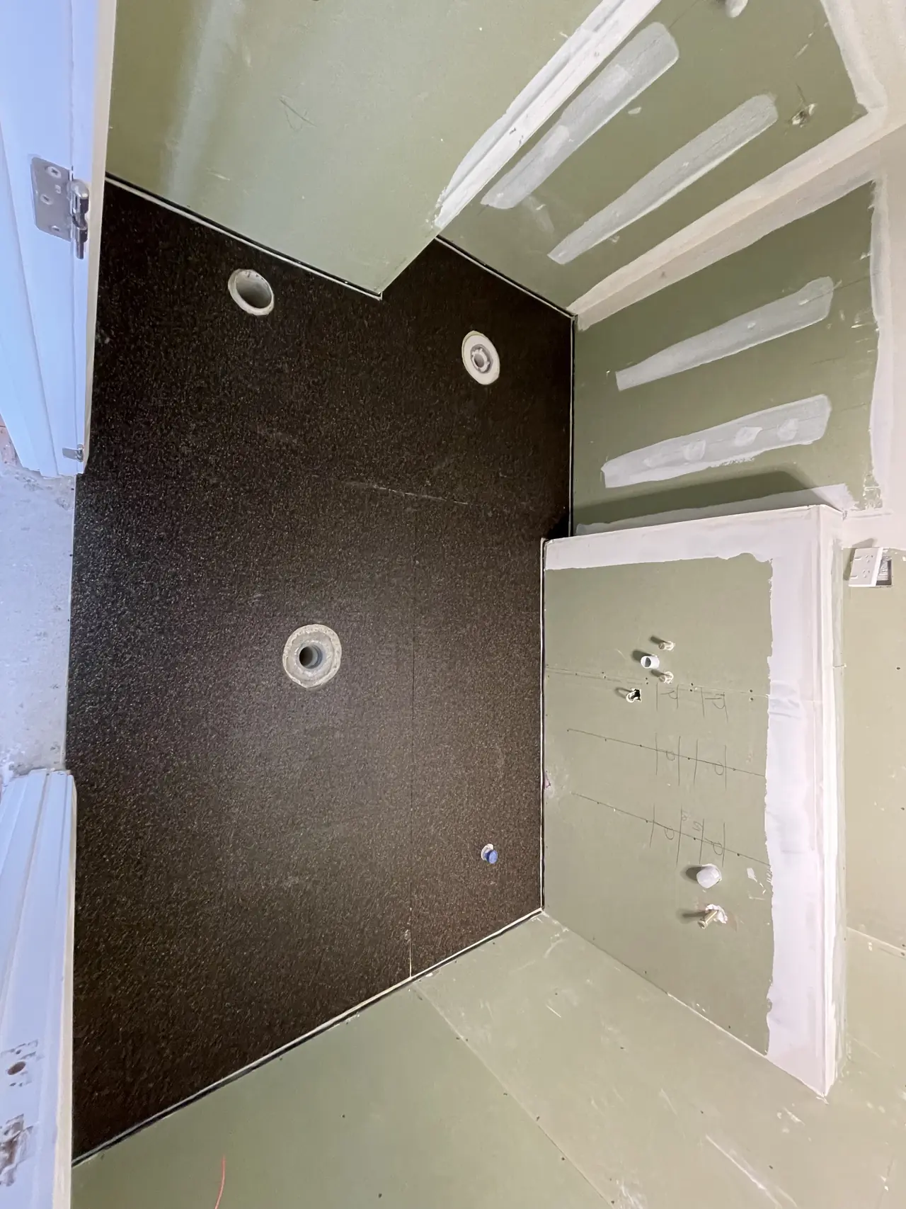Waterproofed shower floor ready for tiling